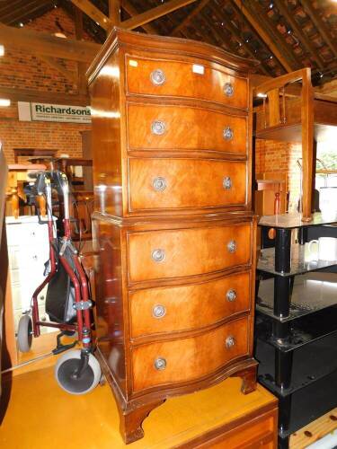 A serpentine mahogany chest on chest, of six drawers, 128.5cm high, 54cm wide, 39cm deep.