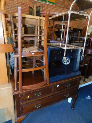 An Edwardian mahogany Chippendale style chest of drawers, 114cm wide, 39cm deep, together with a brass tea trolley, two bedroom chairs and a television stand. (5)