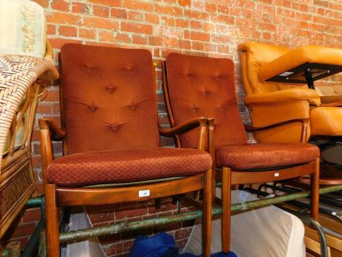 A pair of Parker Knoll oak framed armchairs.