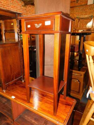 A mahogany two tier night table, 75cm high, 34cm wide.