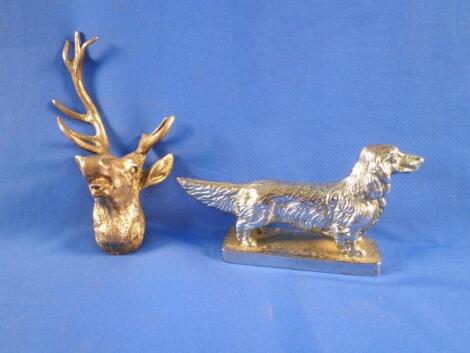 A silver trophy mount in the form of a stags head