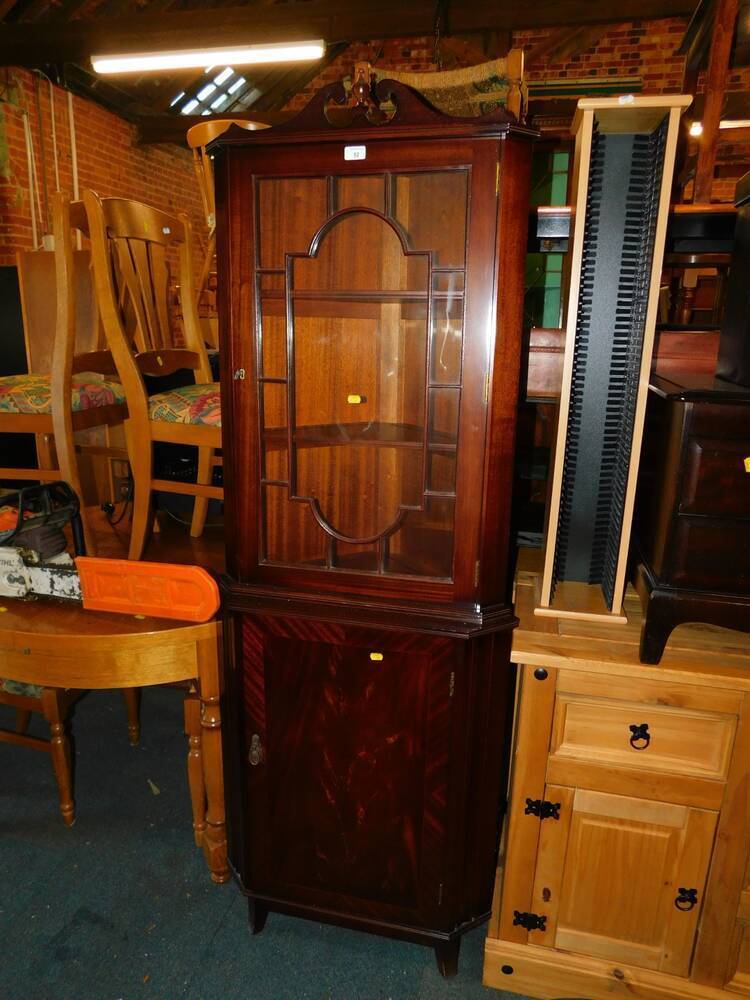 A Strongbow style mahogany corner display with