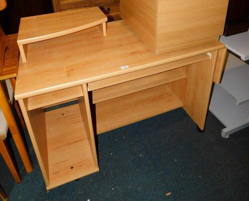 A beech effect kneehole desk, 111cm wide.