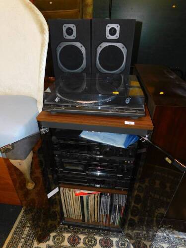 A Technics hi-fi system, comprising turntable SL-BV22D, stereo receiver SA-GX200L, stereo cassette deck RS-BX606 and compact disc player SL-PG400A, together with LPs and CDs in a glass fronted cabinet, and a pair of Wharfdale model S500 speakers.