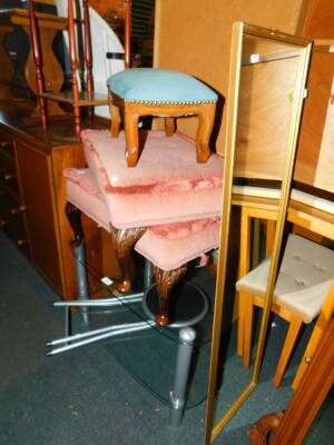 A pair of Georgian style mahogany dressing table stools, upholstered in pink fabric, serpentine mahogany footstool, television stand, gilt rectangular wall mirror, 123cm high and a folding table. (6)