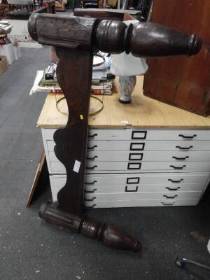 A carved oak bed foot board, with turned finials, 137cm wide.