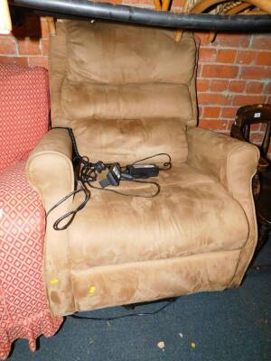 A brown suede electric reclining armchair.