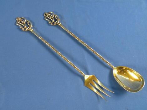 A pair of silver gilt salad spoons