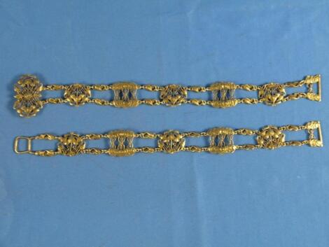 A Liberty & Co style silver belt decorated overall with stylised tulips