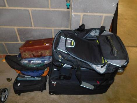 Three suitcases, brown leather work case and assorted holdalls, etc. (a quantity)