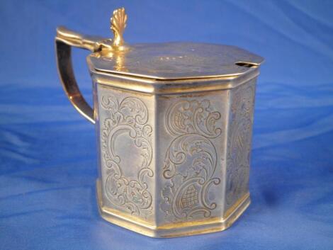 A Victorian silver octagonal drum shaped mustard pot with a shell cast