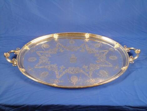 A Victorian silver two handled tray with a pierced border