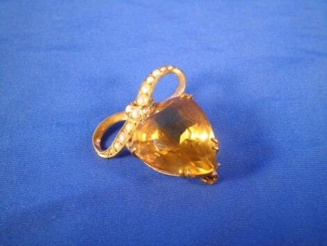 A gold brooch, set with a tear drop shaped citrine and with seed