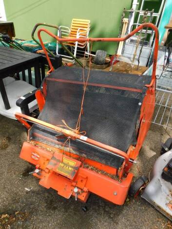 A grass cutting collector attachment for a ride on mower.