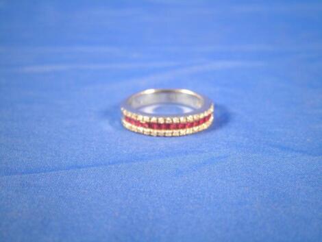 A ruby and diamond eternity type ring with baguette cut stones