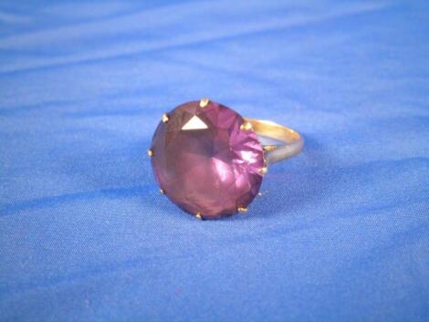 An amethyst dress ring set in 9 carat gold