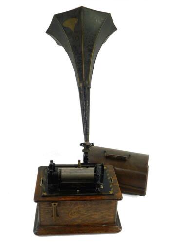 An Edison Standard Phonograph, oak cased, No 634943, with a tin trumpet.