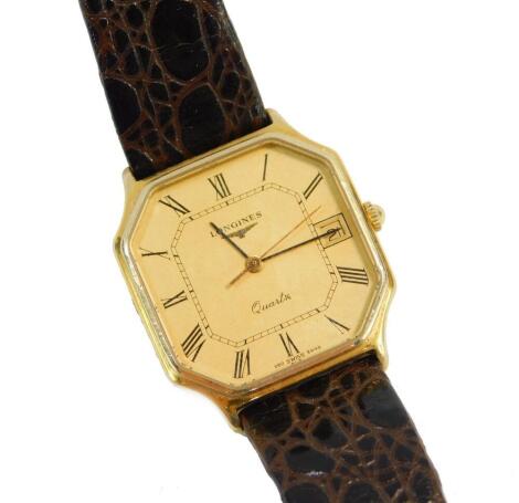 A Longines gentleman's gold wristwatch, gold octagonal dial bearing Roman numerals, centre seconds, date aperture, quartz movement, serial number 54419659, on a leather strap.