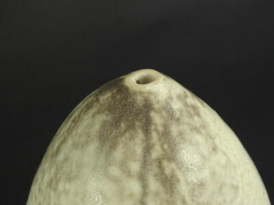 Martin Pearce. A ceramic bullet shaped bud vase, with cream and grey speckled glaze, incised monogram mark to underside, 17cm high. Provenance: The Dayabandhu Collection - 2