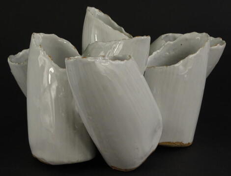 A studio pottery barnacle type vase, with seven separate receptacles and a white glaze, unmarked, 20cm wide. Provenance: The Dayabandhu Collection