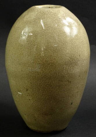 A studio pottery bullet shaped vase, with all over cream crackle glaze, indistinct M or E mark to underside, 21cm high. Provenance: The Dayabandhu Collection