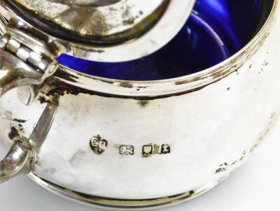 A George V silver harlequin condiment set, comprising mustard pot, 5cm high, open salt, pepper pot and two spoons, in James Usher case, London 1924, 3.6oz of silver. - 2
