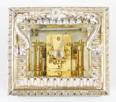 An Elizabeth II silver carriage clock, of small proportion, in elaborate five panel glass case with swing handle, on shaped feet with a lower acanthus leaf border and 3cm back plate with Roman numeric dial and keywind single train movement, marked Made In - 3