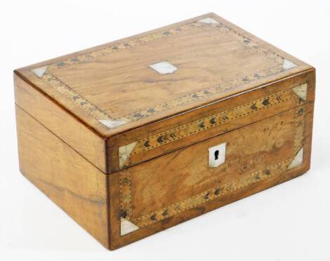 A 19thC walnut Tunbridge jewellery box, of rectangular form with mother of pearl inlay and vacant shield cartouche and escutcheon, with a plain interior, 12cm high, 25cm wide, 17cm deep.