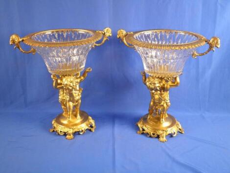 Milo. A pair of gilt brass and glass centre pieces