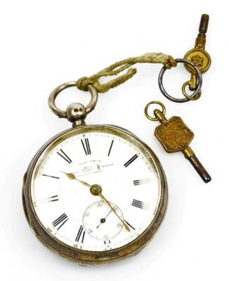 A Victorian silver open faced pocket watch, the 5cm diameter Roman numeric dial with subsidiary Arabic date aperture marked Reliable Trademark Registered in a plain case with vacant cartouche, Chester 1898, with key, 7.5cm high.