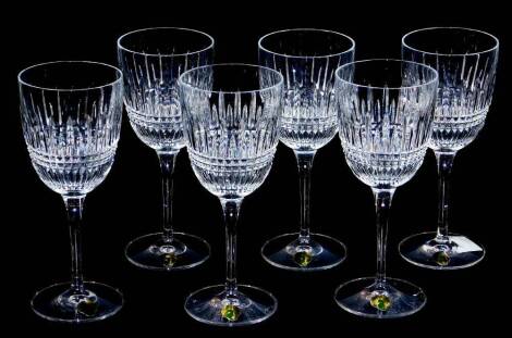 A set of six Waterford crystal wine glasses, each with bell shaped bowls, hobnail cut with a repeat geometric pattern, with shaped stems and circular domed feet, marks beneath, 20cm high. (boxed)