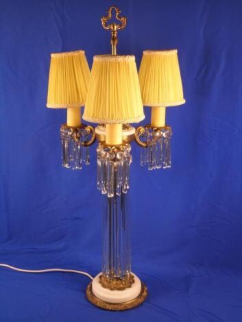 A gilt brass and white marble table lamp