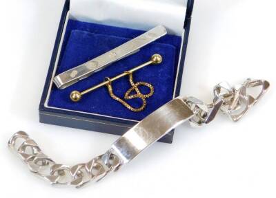 A heavy silver wrist name bracelet, with O shaped links and vacant cartouche, 15cm wide, a sterling tie clip, etc. (3)