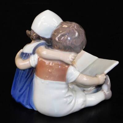 A 20thC B & G Copenhagen figure group of children, no.1567, predominately in blue and white, marks beneath, 9cm high. - 2