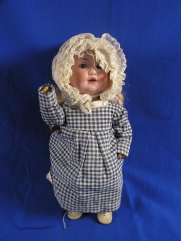 An Armand Marseille bisque headed doll with a blonde wig