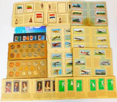 Various coins, cigarette cards, etc., Player & Sons Tennis part sets, Kings & Queens of England, Medical Discovery stamps, various other trade cards, Park Drive, Kensitas National Flags Silks part set, cased coin sets 1967 to include sixpence, another. (a