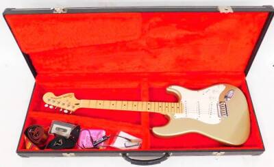 A late Squier Stratocaster Fender standard series guitar, marked Crafted In China, S/N/CY02117023, with shaped body in fitted case, 107cm wide and other items. (a quantity)