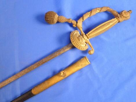 A ceremonial sword, the gilt metal handle cast with a crown above