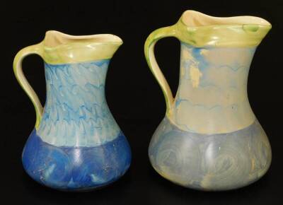 A graduated pair of mid 20thC Myott & Sons pottery jugs, no. 8509, each in blue and green striped pattern, 22cm high, etc. (2) - 3