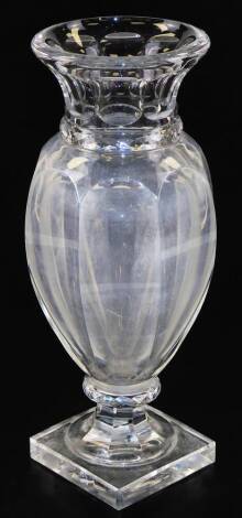 A 20thC Baccarat glass vase, with compressed trumpet top, shaped body and inverted compressed stem on a square base, marked beneath, 36cm high.