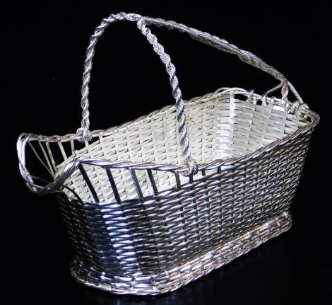 A 20thC French Christofle silver plated wine basket, with entwined handle, 21cm high.