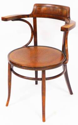 An early 20thC bentwood chair, with shell design to the circular seat, on cylindrical sabre front and plain sabre back legs, impressed mark, 83cm high.