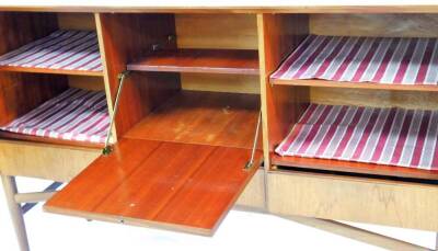 A vintage teak Meredew sideboard, of rectangular form, with three cupboards on turned legs joined by shaped front to back stretchers, 94cm high, 141cm wide, 48cm deep. - 2