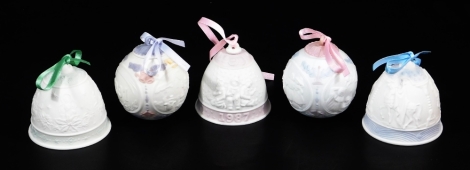 Five various Lladro Christmas bells, with ribbons to include in blue, pink, green colour way, 7cm high, printed marks beneath, etc. (a quantity)