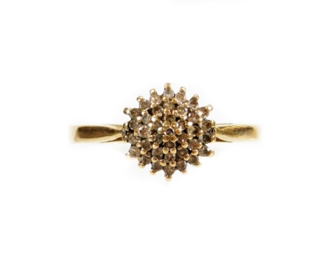 A dress ring, with stepped small white stones, on a plain part pierced shank, marked 375, size O-P, 2.3g all in.