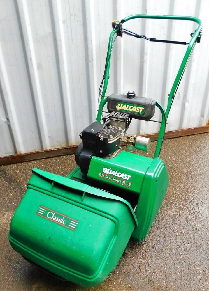 A Qualcast classic petrol 35S lawn mower with grass box 98cm high