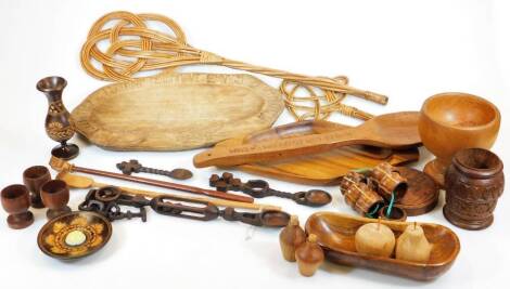 Various treen, carved dish, worlds greatest wife beater spoon, 24cm wide, bowl, carpet beaters, egg cups, etc. (a quantity)