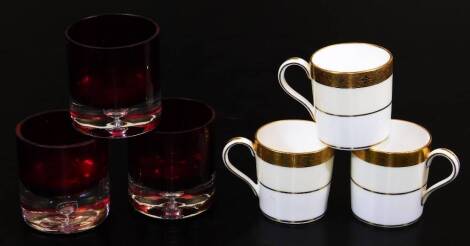 Three Minton coffee cans, and three clear glass drinking glasses.