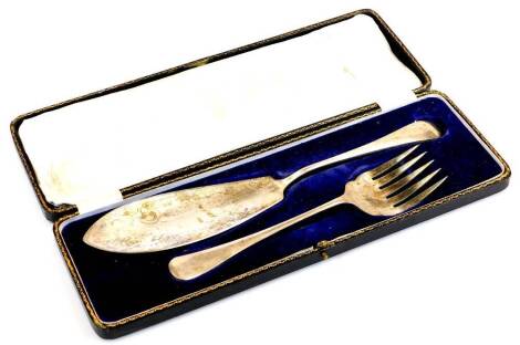 A pair of silver plated fish servers, in fitted case.