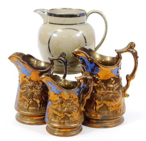 A set of three graduated Victorian copper lustre pottery jugs, moulded with daisies and blue spring decoration and drab ware Faith, Hope and Charity silver lustre jug, 20cm down. (4)